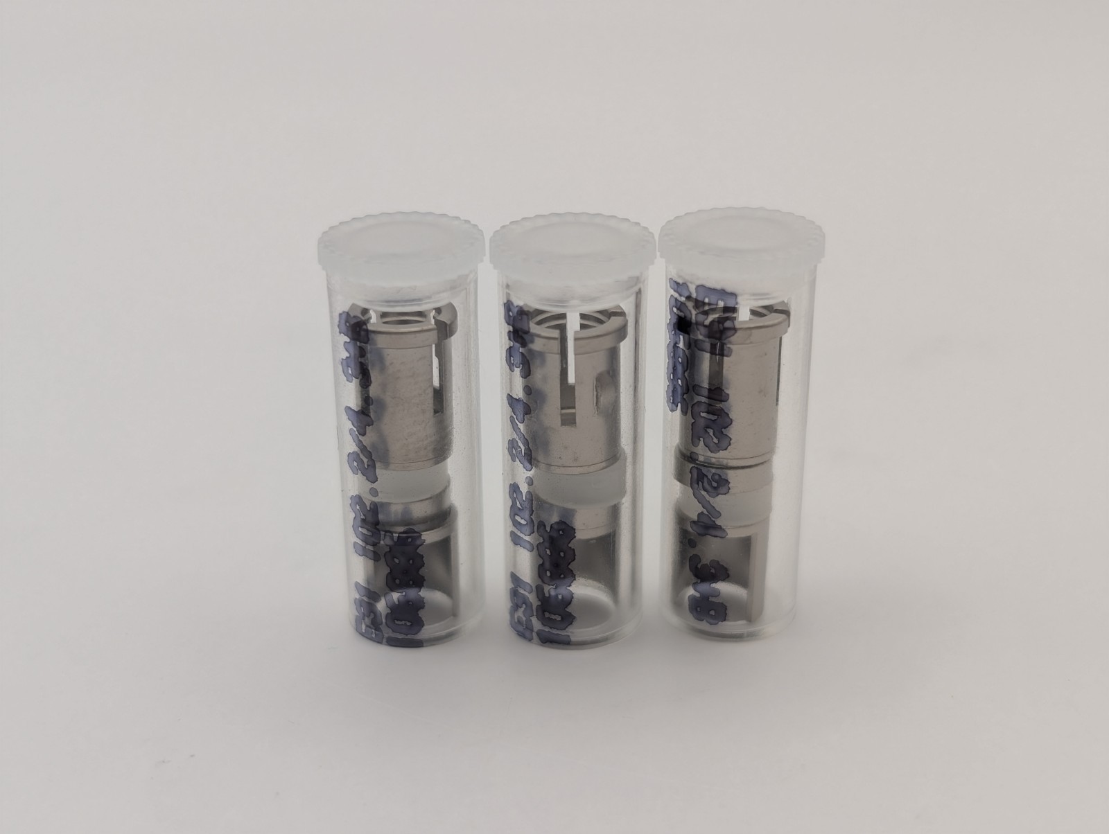 Precision machined components in clear protective tubes