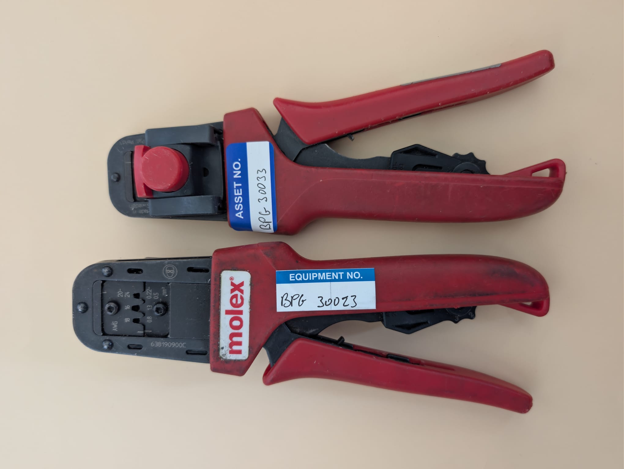 Molex crimpers before refurbishment with asset tags